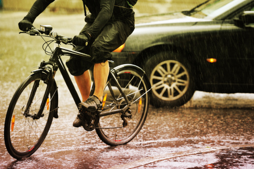 Man on a bicycle, a rainy day in Stockholm, Sweden