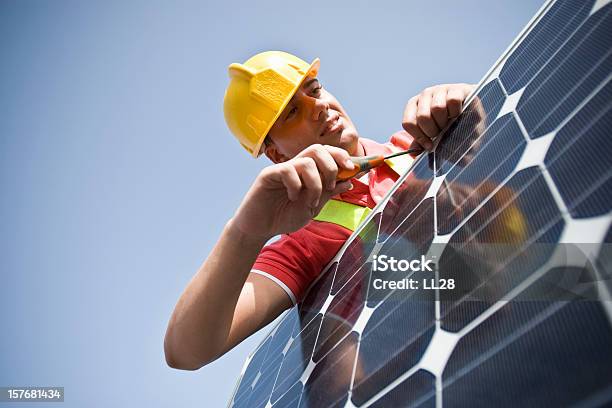 Tightening Stock Photo - Download Image Now - Adult, Adults Only, Blue-collar Worker
