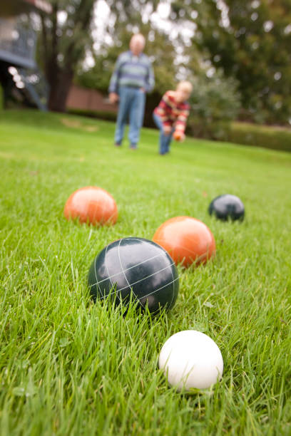 Couple playing bocce ball stock photo