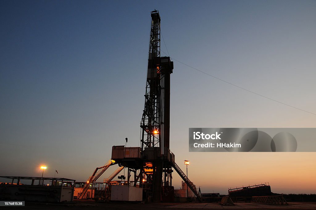 Drilling rig - night shot A night shot of a drilling rig right after sunset. Back Lit Stock Photo