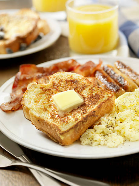 French Toast with Bacon and Eggs  french toast bacon bread butter stock pictures, royalty-free photos & images