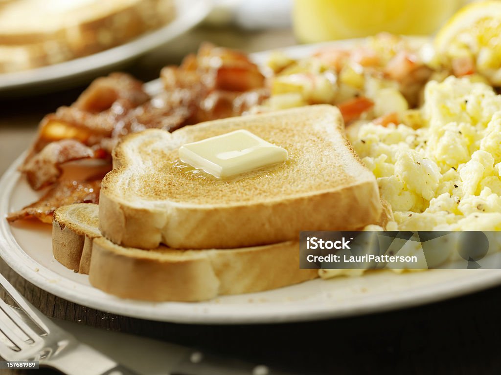 Buttered Toast with Bacon and Eggs Buttered Toast with Bacon and Eggs, Tomatoes, Hash Browns and Toast-Photographed on Hasselblad H3D-39mb Camera Omelet Stock Photo