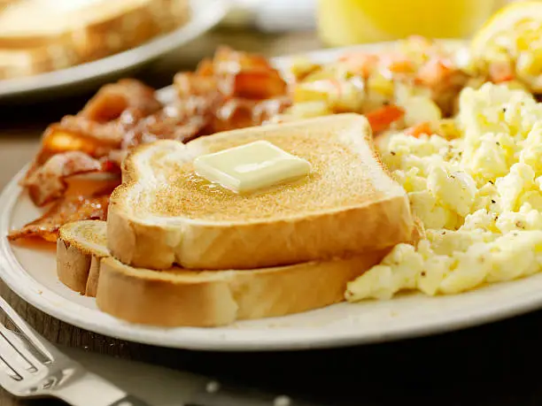 Photo of Buttered Toast with Bacon and Eggs