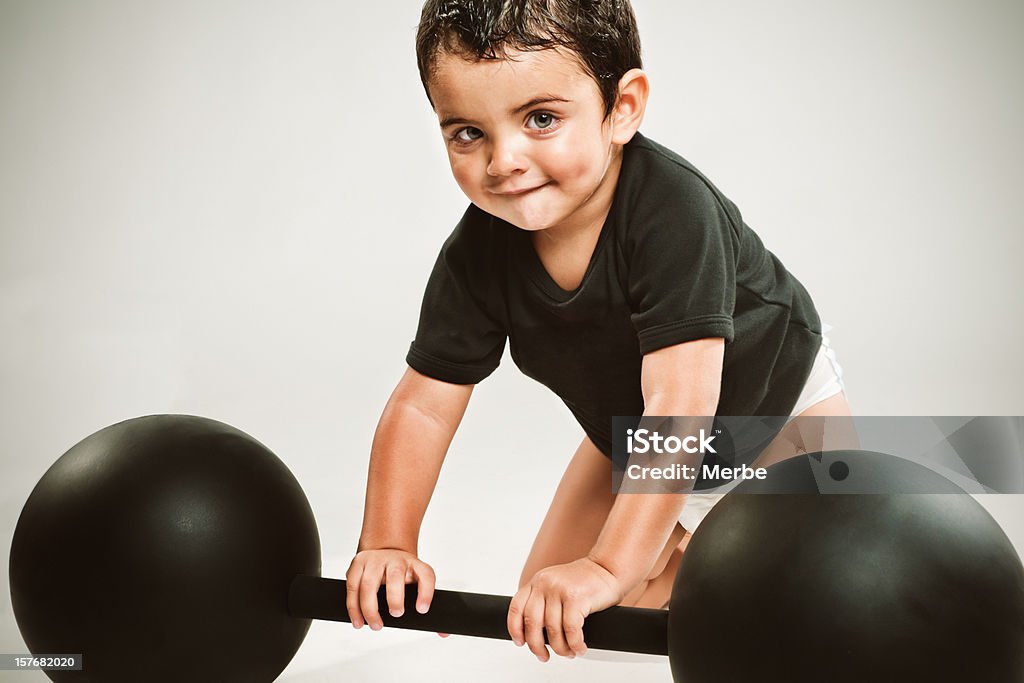 Strong little man little man with weight training Baby - Human Age Stock Photo