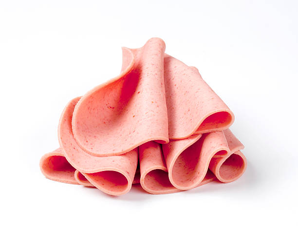 4 slices of Bologna stacked on each other Sliced bologna baloney photos stock pictures, royalty-free photos & images