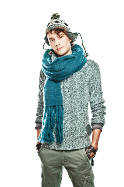 Ecuadorian young man in a casual jacket and patterned scarf looking pensive, embodying travel and leisure in the city.