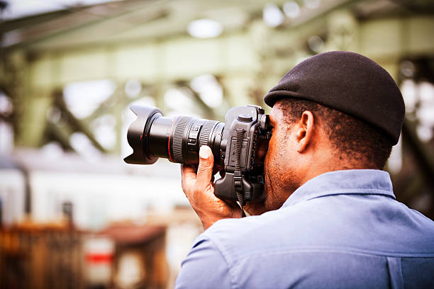 istock Photographer shooting with DSLR camera 157682252
