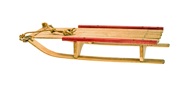 A child's wood vintage sled with clipping path ... side view.