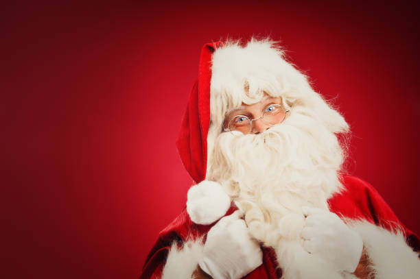 istock Happy Santa Claus isolated on red 157682453