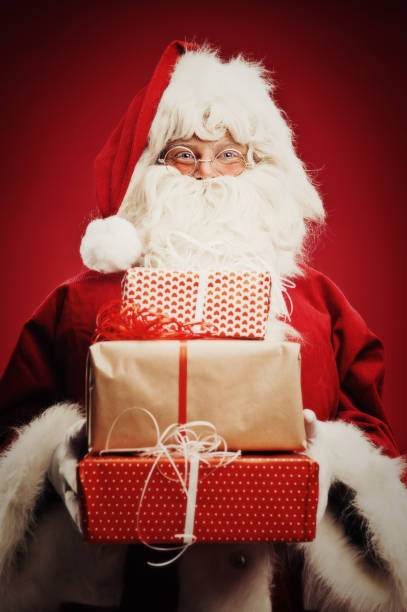 istock Happy Santa Claus isolated on red 157682526