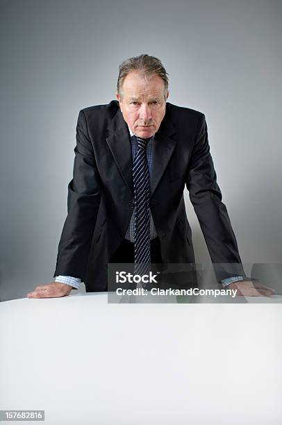 Stern Looking Bank Manager Portrait Stock Photo - Download Image Now - Interrogation, Table, Adults Only