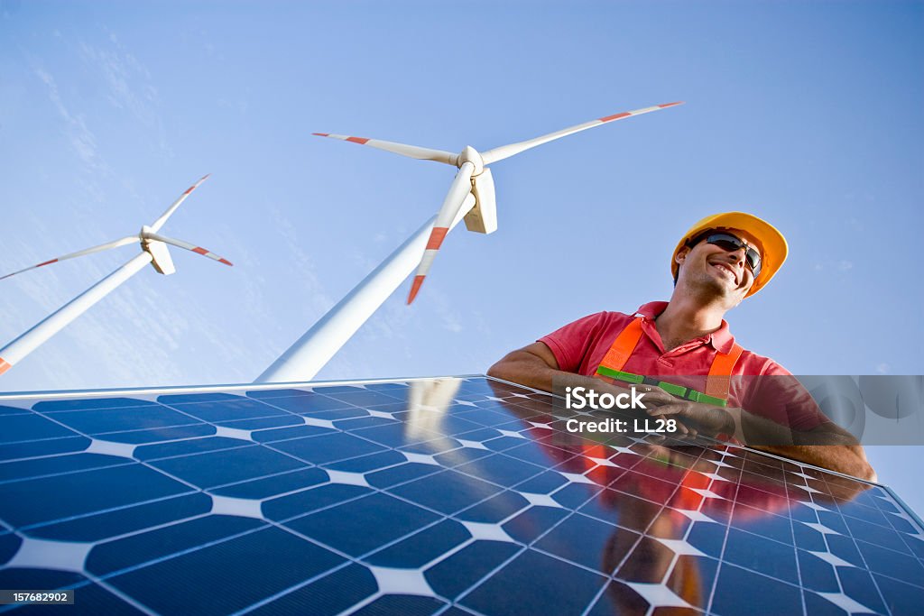 Worker installing solar panels and modern wind mills - Royalty-free Rüzgar Türbini Stok görsel Worker installing solar panels and modern wind mills - Royalty-free Rüzgar Türbini Stok görsel