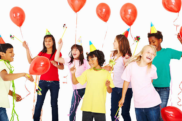istock Joyful multi ethnic kids with balloons dancing in birthday party 157683066