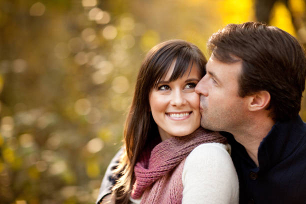 istock Happy Couple Sitting Together Outside During Autumn 157683096