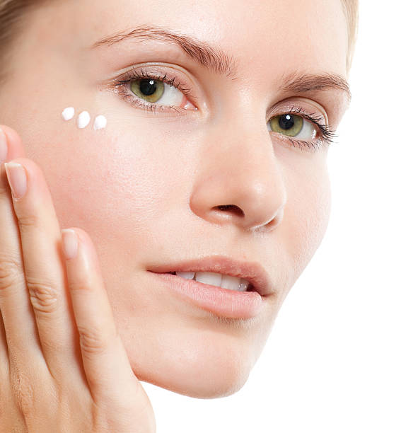 facial massage with cream stock photo