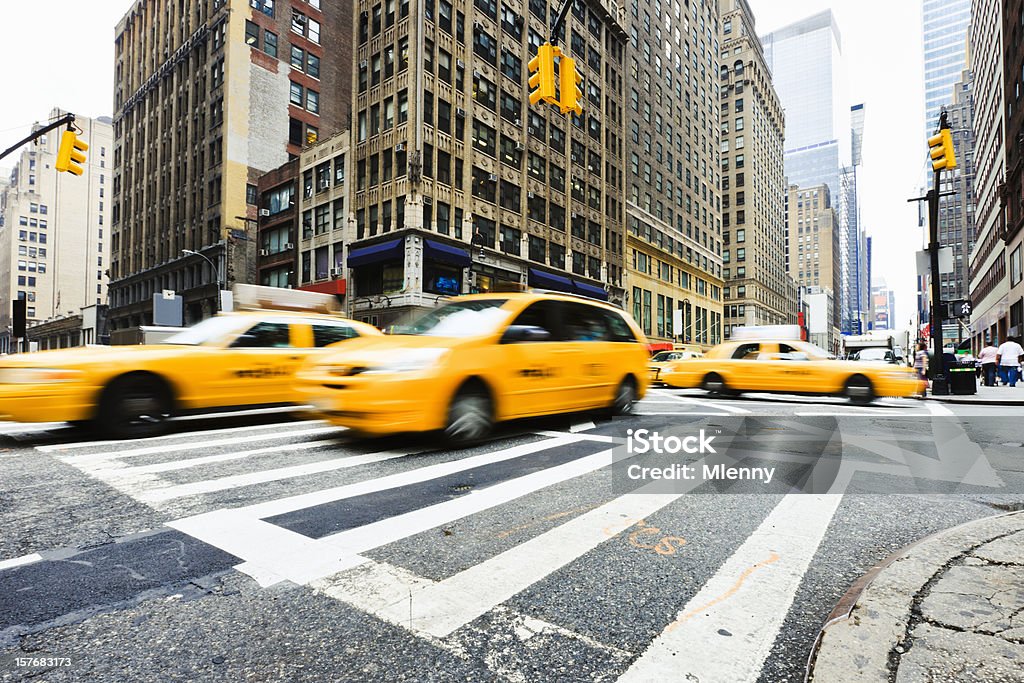 Crossroad Taxi Traffic New York City New York Manhattan street with speeding motion blurred taxis - yellow cabs. Manhattan, New York City, USA. New York City Stock Photo