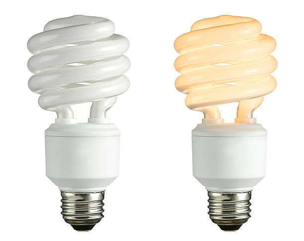 Two light bulbs on a white backdrop, one white and one warm on and off light bulbhttp://www.benimage.com/lampbanner.jpg energy efficient lightbulb stock pictures, royalty-free photos & images