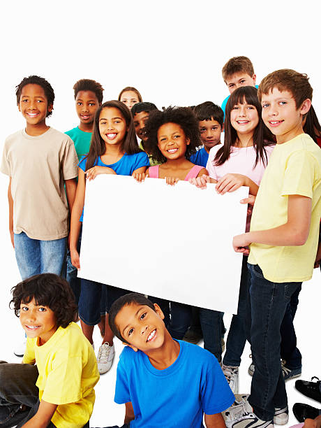 istock Happy multi ethnic children displaying your text on a billboard 157683528