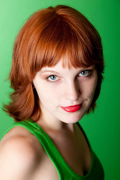 istock pretty red headed young woman 157683549