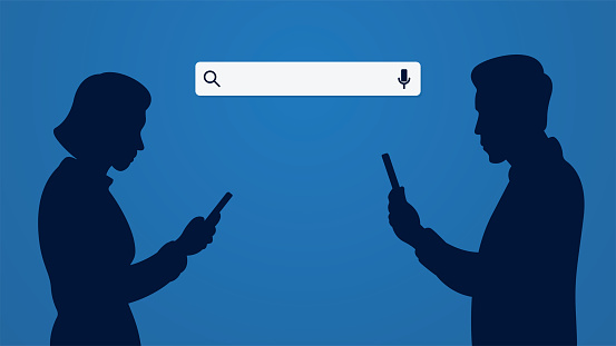 One man and one woman silhouettes are using smartphones on a blue background and there is a search engine bar behind them.