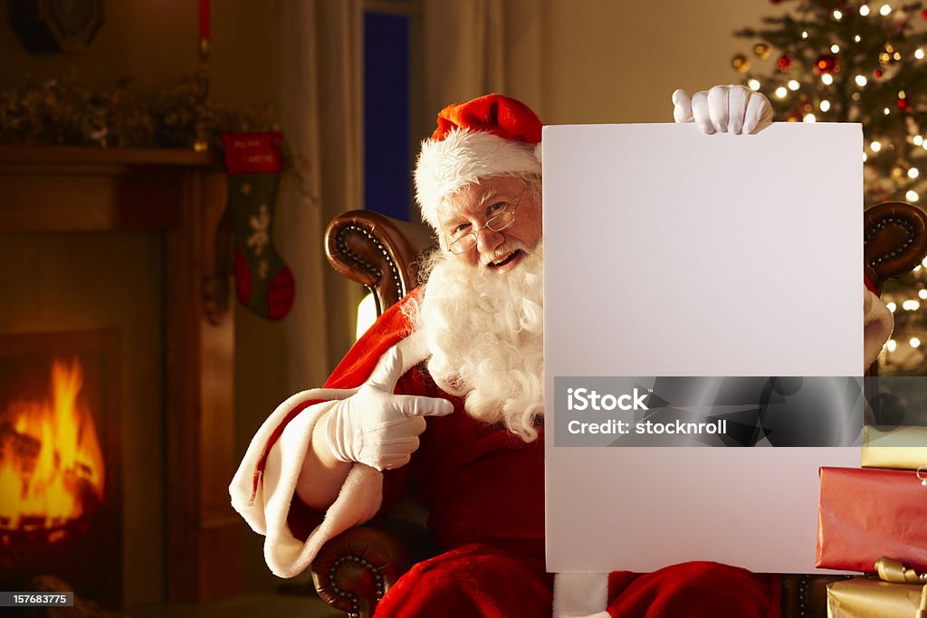 ジョリー父親;クリスマス保持ホワイトボード - サンタクロースのロイヤリティフリーストックフォト