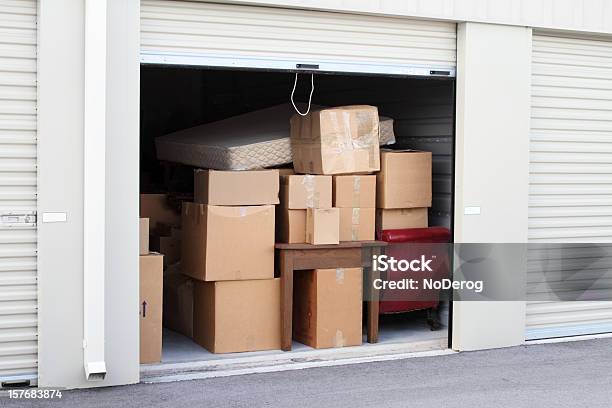 Self Storage Warehouse Building With An Open Unit Stock Photo - Download Image Now - Storage Compartment, Storage Room, Self Storage