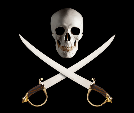 Photograph of a skull with a pair of Swords crossed below - A classic Pirate theme.