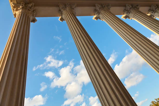 istock Worm's eye view of majestic columns framing sky and clouds 157684304