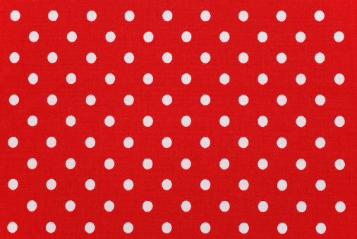 white polka dots on red fabric