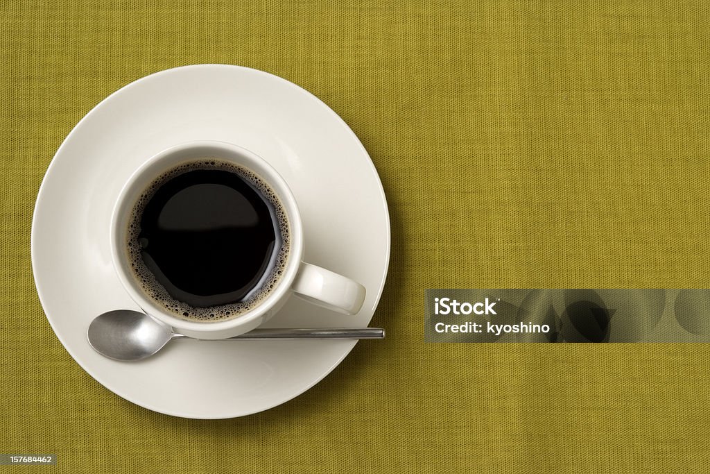 ブラックコーヒーやスプーンの緑のテーブルクロス、コピースペース付き - コーヒーのロイヤリティフリーストックフォト