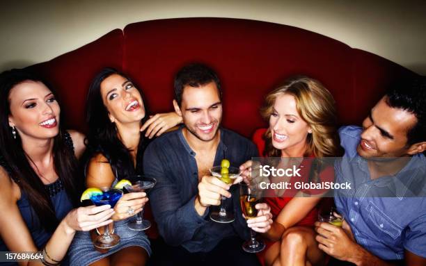 Happy Young Couples Enjoying Drinks At A Nightclub Stock Photo - Download Image Now - Drinking, Night, Organized Group Photo