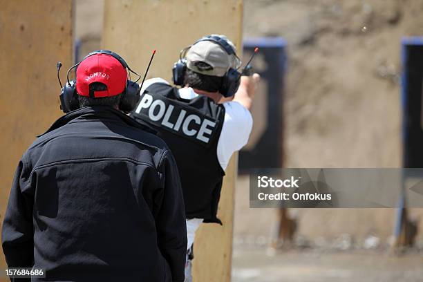 Policeman Officer Shooting 9mm Handgun With Instructor Stock Photo - Download Image Now