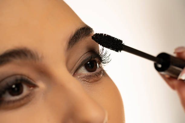 istock Woman applying mascara 1576847959