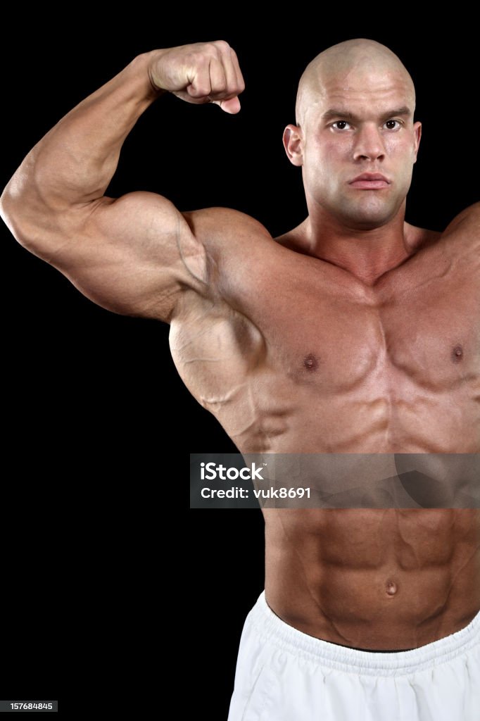 Bodybuilder in posa - Foto stock royalty-free di A petto nudo