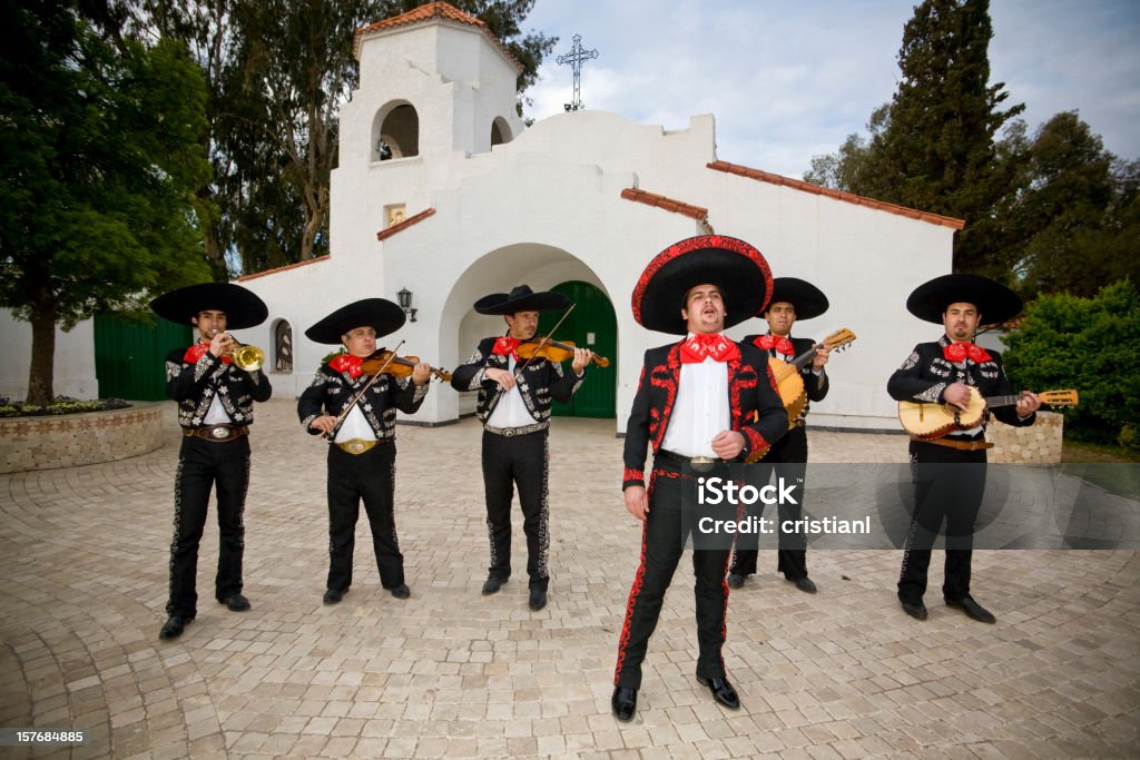 Mariachi Mariachi Band Singing and playing guitars, Trumpets and Violins Mariachi Stock Photo