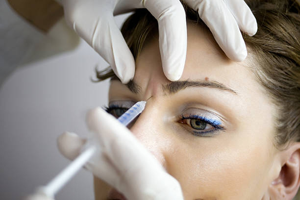 istock A woman having Botox injections 157685010
