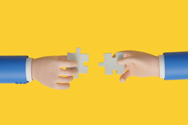 istock Two cartoon hands connecting jigsaw puzzle isolated on yellow background. Teamwork concept. 3d illustration. 1576850392