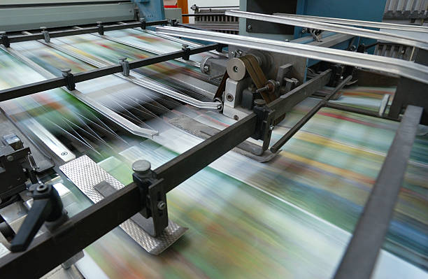 Offset printing machine while it's running, close-up stock photo