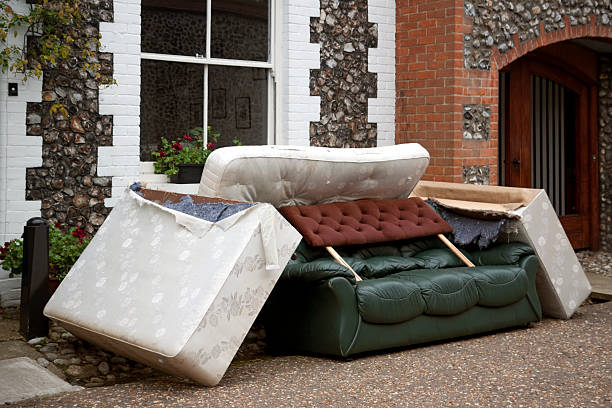 Discarded furniture A pile of discarded furniture in a street. dirty old couch stock pictures, royalty-free photos & images