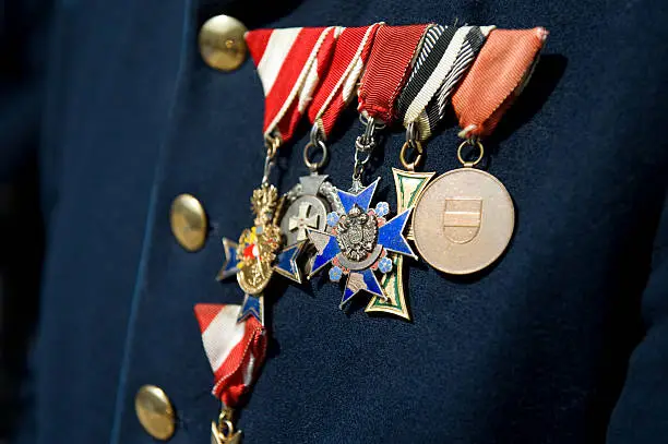 Military dress uniform with many medals and ribbons.