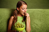 girl eating grape