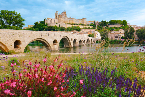 Beziers Cathedral with Pont Vieux and Orb river France stock photo