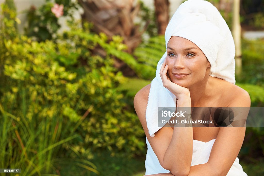 Fresh mid adult woman after bath in thought - outdoors  Mature Women Stock Photo