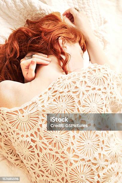 Redhead Woman Lying In Bed With Face Obscured Stock Photo - Download Image Now - Women, Lying Down, One Woman Only