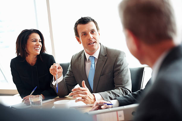 istock Middle aged business man discussing something with colleagues 157685685