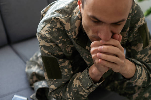 istock Soldier In Uniform Suffering From Stress 1576858592