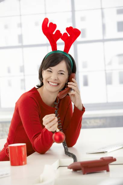 istock X-mas woman in antler hat 157686147