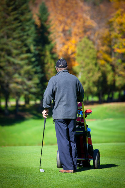 istock Senior Golf Player in Action in Autumn 157686245