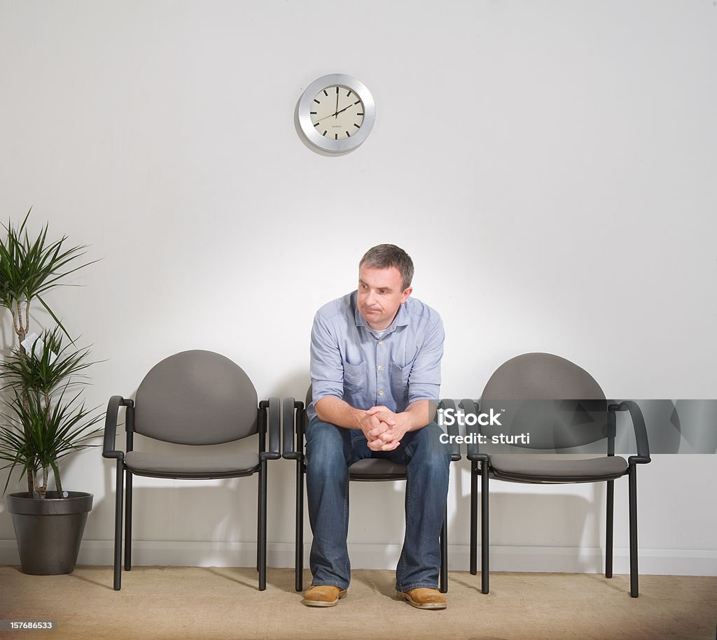 Man Sitting in a Waiting Room  Waiting Room Stock Photo