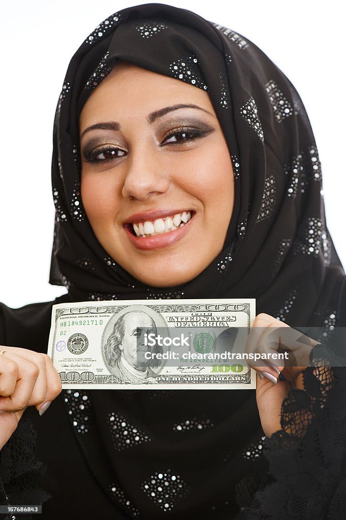 Árabe businesswoman holding 100 dólares - Foto de stock de Dinero libre de derechos